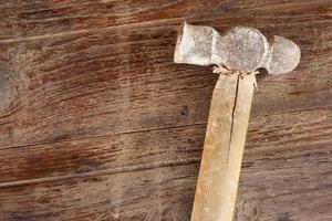 old Hammer on wood background photo