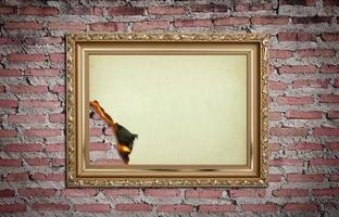 vintage gold frame with burned on wall  background photo