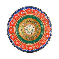 A top view of an oriental ceramic plate with a floral pattern on a white background, Uzbekistan photo