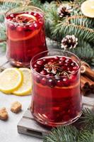 Cranberry juice with lemon and cane sugar. Winter hot drink. photo