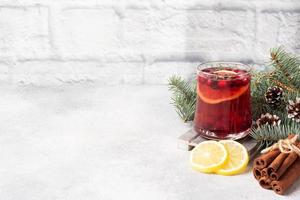 Cranberry juice with lemon and cane sugar. Winter hot drink. Copy space photo