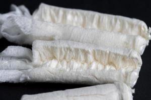 Sewn cotton wool for use as tampons photo
