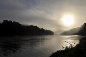 Small fog on the river in autumn photo