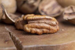 Pecan in a shell on the table photo