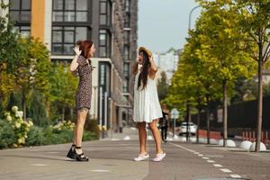 Happy meeting of two friends hugging in the street photo