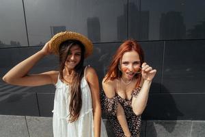 Two attractive young women fooling around in fresh air. photo