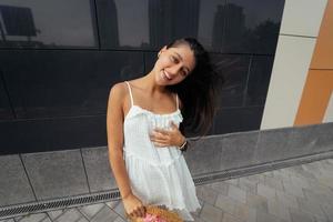 Cute young woman laughing at the camera photo