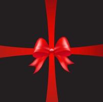 Shiny red color satin ribbon on black background vector