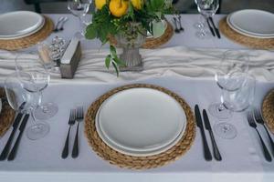 Festive table at the wedding party decorated with lemon arrangements photo