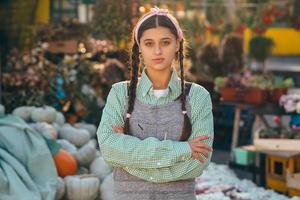 Farmer female poses for the camera in front of the counter. photo