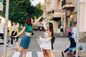 Two students high five to teach others after successful work together photo