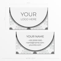 Print-ready white business card design with black patterns. Business card template with place for your text and abstract ornament. vector