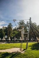 Woman wants to go bungee in the rope park photo