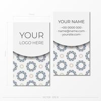 White business card with an ornament. Print-ready business card design with space for your text and abstract patterns. vector