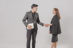 Two confident businessman shook hands during office meetings. photo