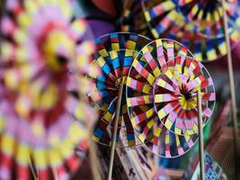 Close-up view of colorful paper windmill photo