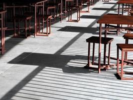 Arranged table and chairs in a restaurant photo