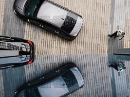 High level view of cars and its reflection at a hotel drop-off zone photo