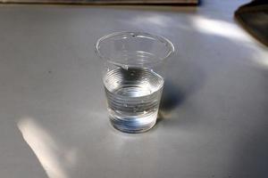 A non-alcoholic soft drink is poured into a glass. photo