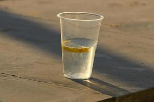 A non-alcoholic soft drink is poured into a glass. photo