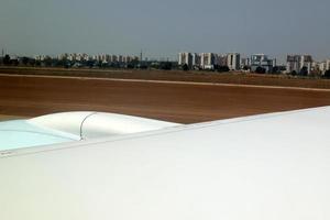 The earth is seen through the porthole of a large jet plane. photo