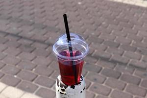 A non-alcoholic soft drink is poured into a glass. photo