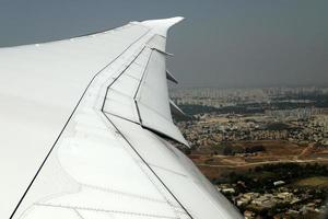 The earth is seen through the porthole of a large jet plane. photo