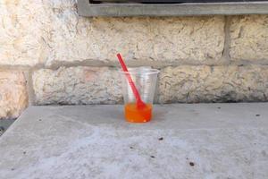 A non-alcoholic soft drink is poured into a glass. photo