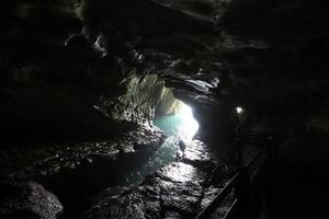 Grottoes in the chalk cliffs on the shores of the Mediterranean Sea. photo