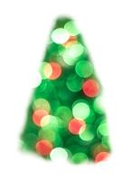 Green Christmas lights fir tree bokeh - A bright bokeh background created by Christmas lights photo