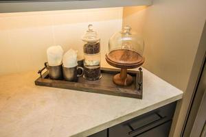 Serving Tray With Coffee BeansAnd Mugs In Pantry Corner photo