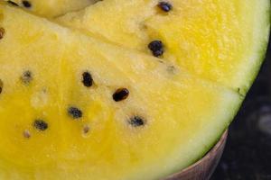 Sliced ripe yellow watermelon, close up photo