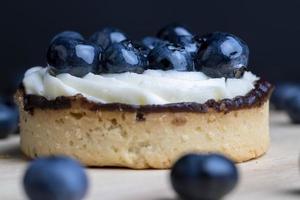Tartlet with cream and blueberry flavor photo