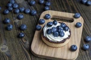 Tartlet with cream and blueberry flavor photo