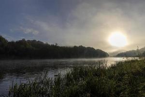 Foggy morning on the river photo