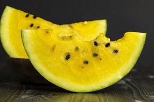 Sliced ripe yellow watermelon, close up photo