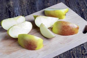 Sliced ripe apple on a cutting board photo