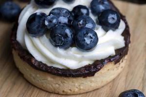 Tartlet with cream and blueberry flavor photo