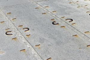 Temporary road made of concrete slabs on a construction site photo