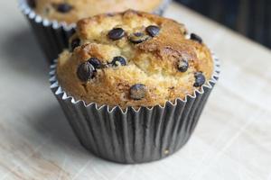 Cupcake with chocolate pieces, close up photo