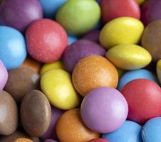 Multicolored chocolates with chocolate filling photo