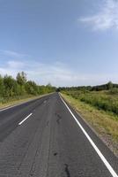 Narrow paved road for cars photo