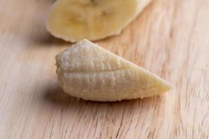 Sliced ripe banana on a cutting board photo