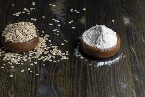 Wheat flour from a wooden bowl photo