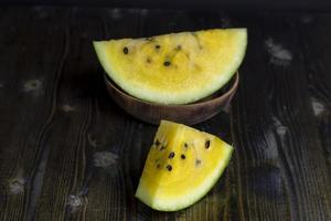 Sliced ripe yellow watermelon, close up photo