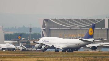 FRANKFURT AM MAIN, GERMANY JULY 19, 2017 - Lufthansa Airlines Boeing 747 brakes after landing, rides at taxi speed. Frankfurt International Airport FRA, Germany video