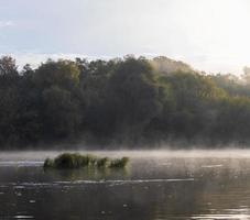 Small fog on the river in autumn photo