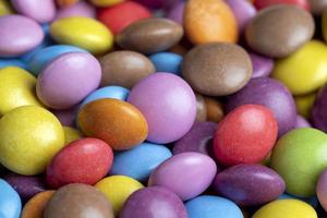Multicolored chocolates with chocolate filling photo