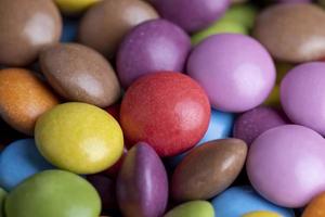 Multicolored chocolates with chocolate filling photo