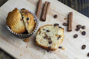 Cupcake with chocolate pieces, close up photo